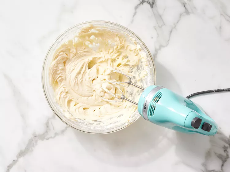 Gradually add the confectioners’ sugar while continuing to beat