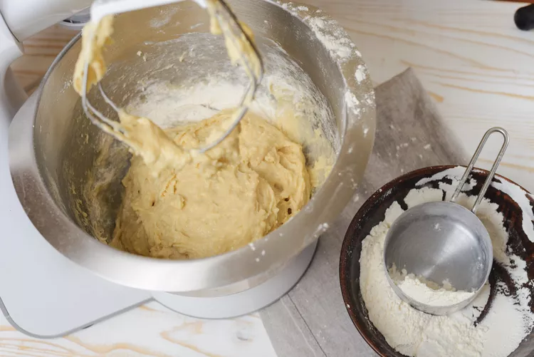 Gradually incorporate the flour until a soft dough forms, mixing until it becomes too stiff to stir and then finishing by hand if needed