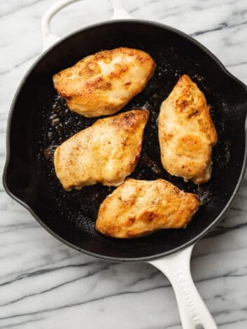 Heat olive oil and part of the butter in a skillet over medium-high heat, then add the chicken and cook until golden on both sides before removing it from the pan
