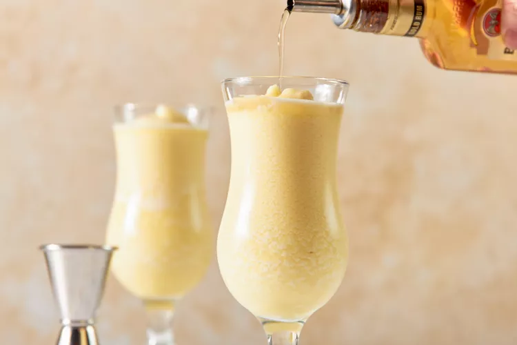 If using the optional golden or añejo rum, slowly pour it over the top so it floats slightly on the surface