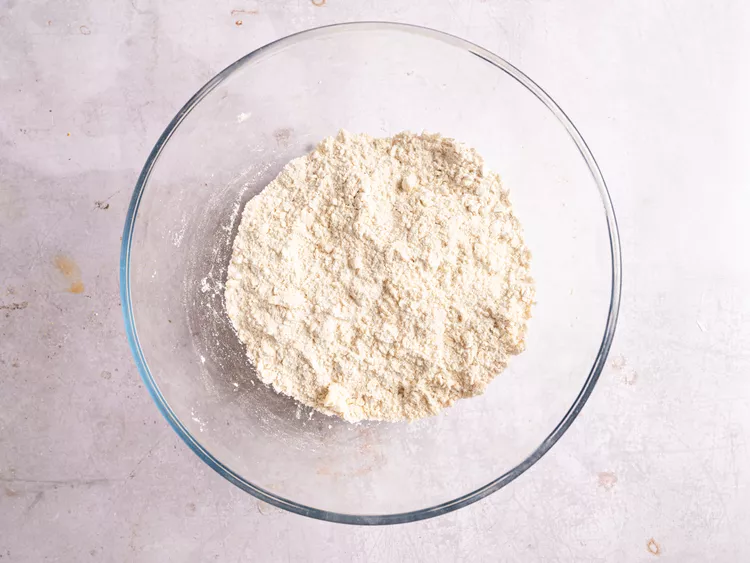 In a large bowl, whisk together both flours, oats, salt, baking soda, and baking powder