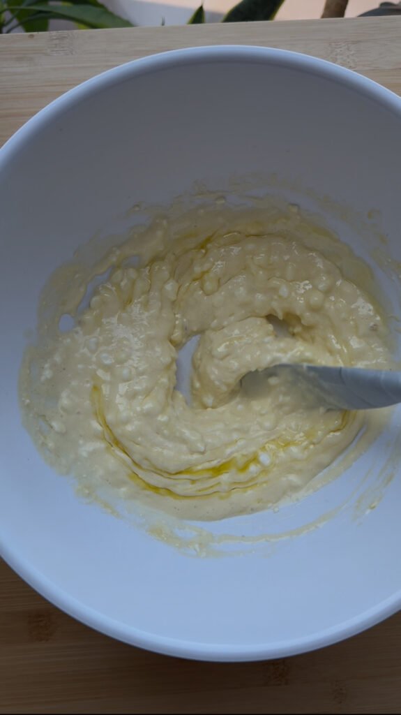 In a medium bowl, whisk together the cottage cheese, Greek yogurt, eggs, milk, and oil until smooth