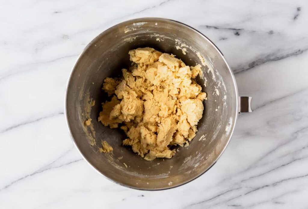 In a separate large bowl, beat the butter, granulated sugar, and brown sugar together on medium-high speed until the mixture becomes light and fluffy