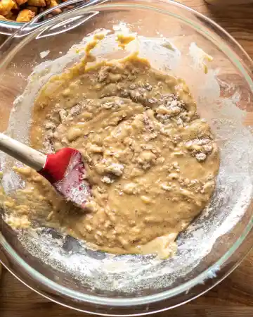 In another bowl, whisk the flour, baking soda, and salt. Add the dry ingredients into the wet mixture and gently stir until almost combined, being careful not to overmix