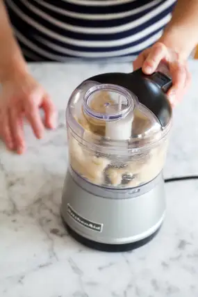 Keep pulsing. At first, the banana will look crumbly and dry