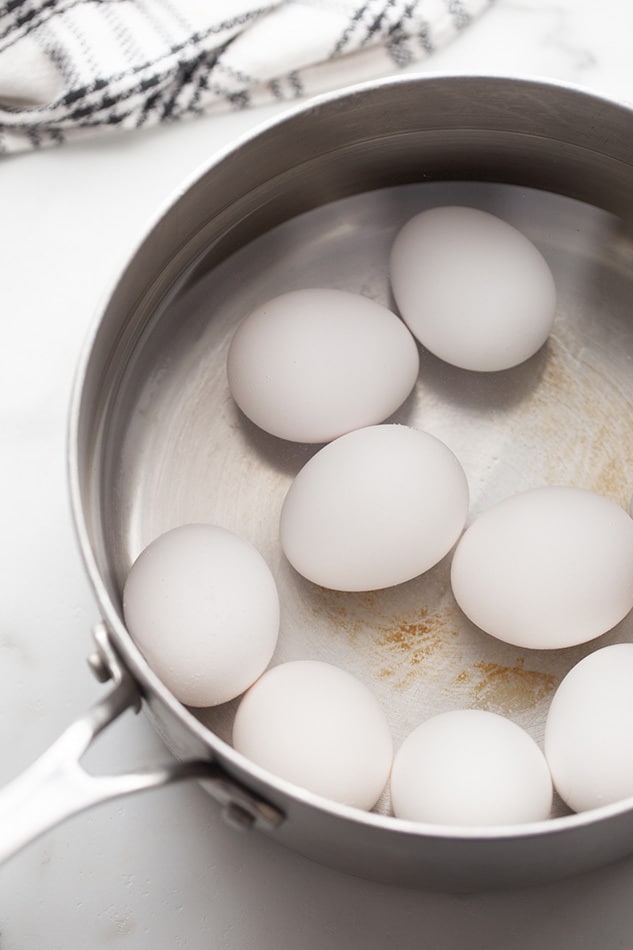 Place the eggs in a pot, cover with cold water, and bring to a boil