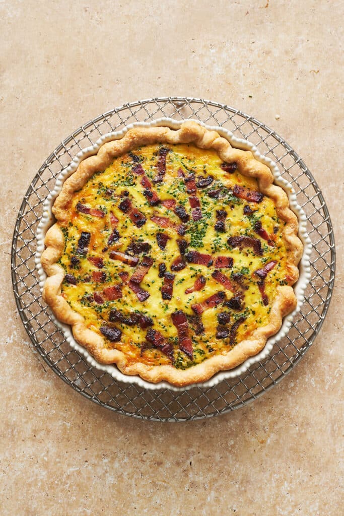 Place the quiche on a baking sheet and bake until the center is set and the top is golden