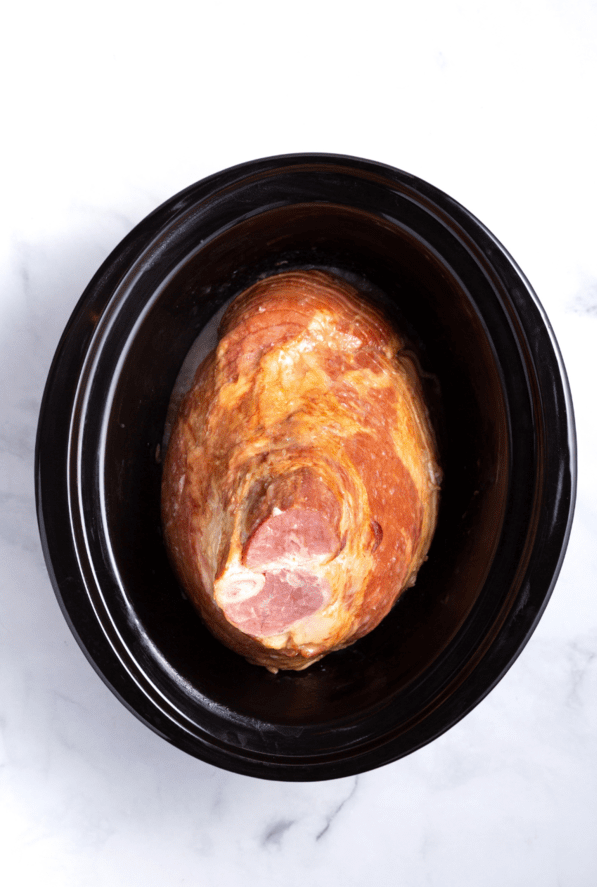 Place the spiral ham into the slow cooker, ensuring it fits comfortably