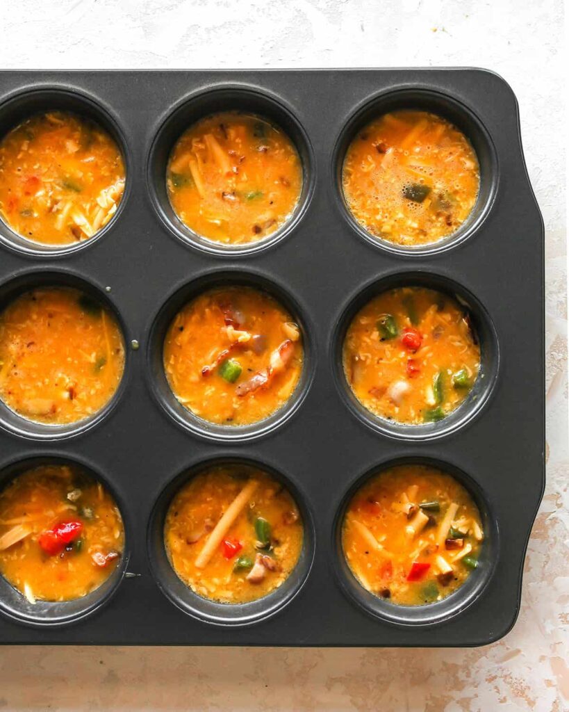 Place the tin in the oven and bake until the tops are set and lightly browned