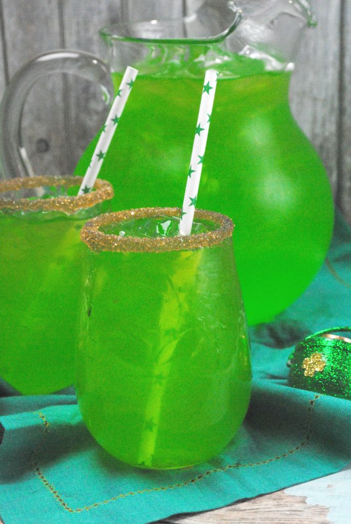 Pour the punch into glasses, add festive straws, and serve immediately