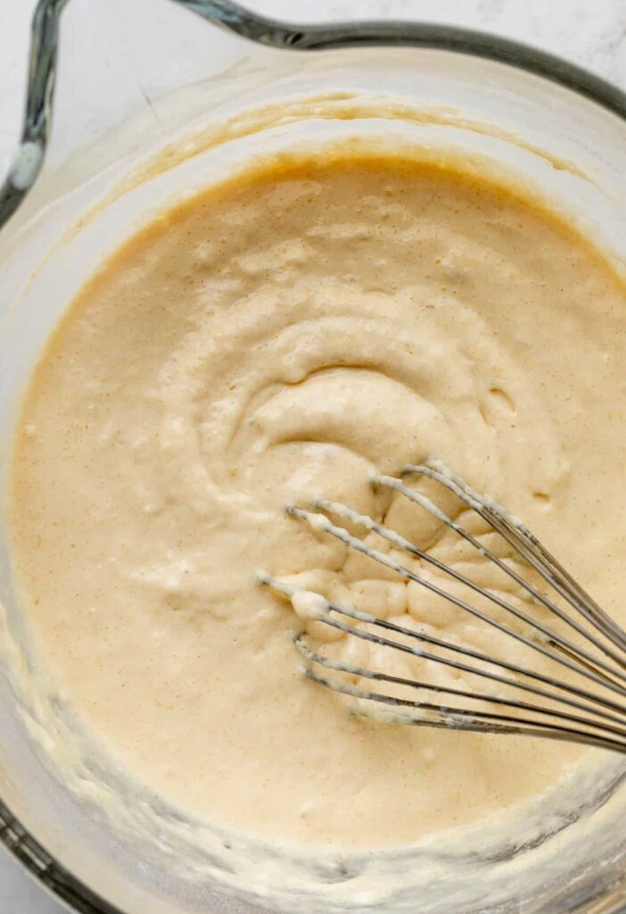 Pour the wet ingredients into the dry ingredients and gently whisk until just combined. The batter should be thick with a few lumps remaining