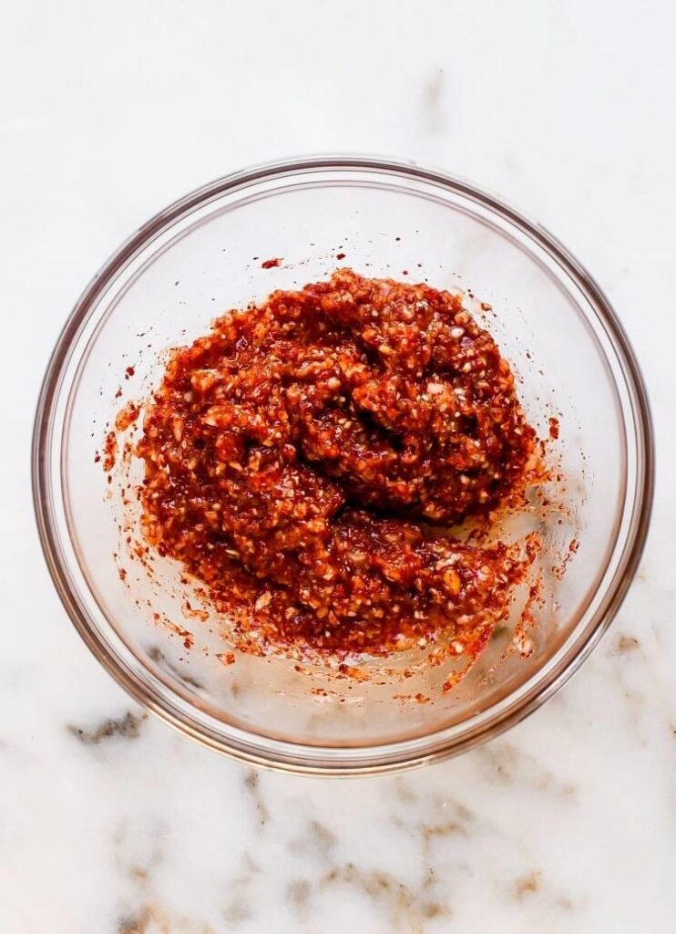 Prepare the rice paste by mixing sweet rice flour and sugar with water in a saucepan