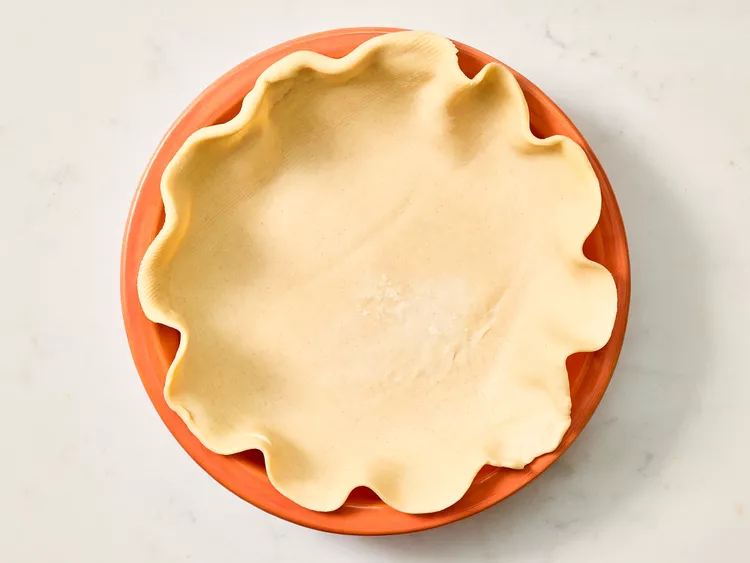 Press one pastry crust into the bottom and sides of the pie pan