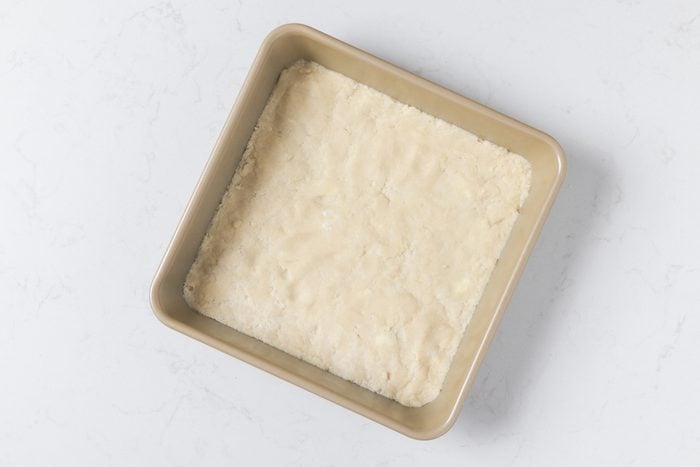 Press this mixture evenly into the bottom of an ungreased square baking pan to form the crust
