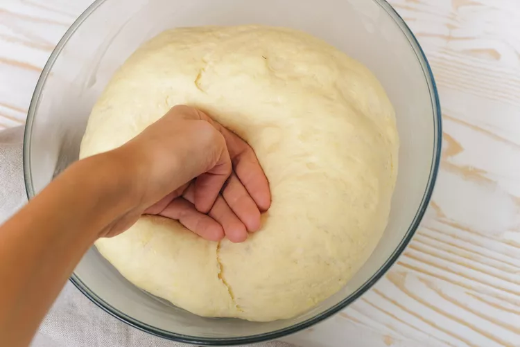 Punch down the dough and roll it out to about half-inch thickness