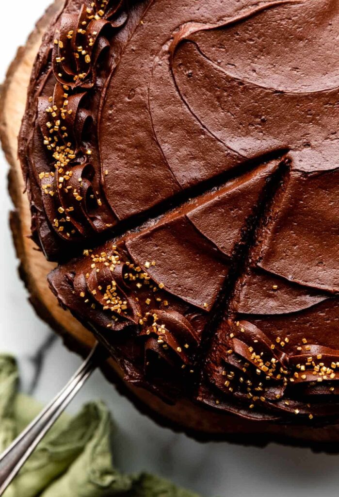 Refrigerate the frosted cake for 30–60 minutes before slicing to help it set