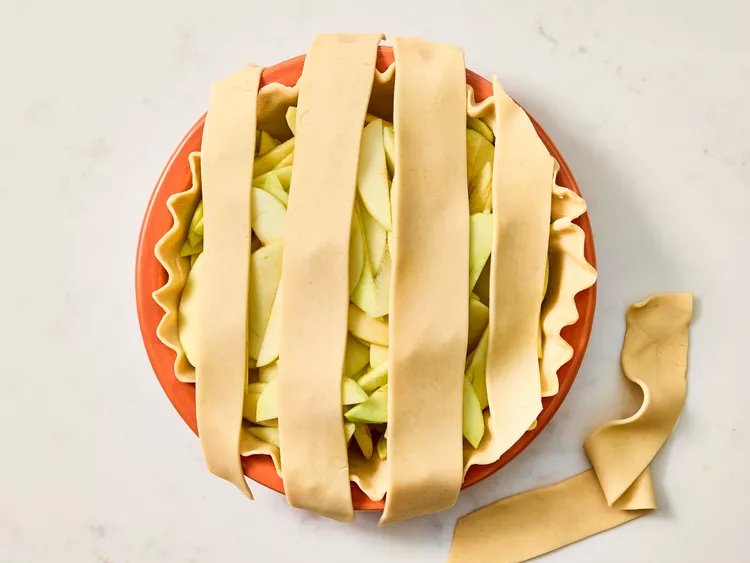 Roll out the remaining pastry and cut it into strips