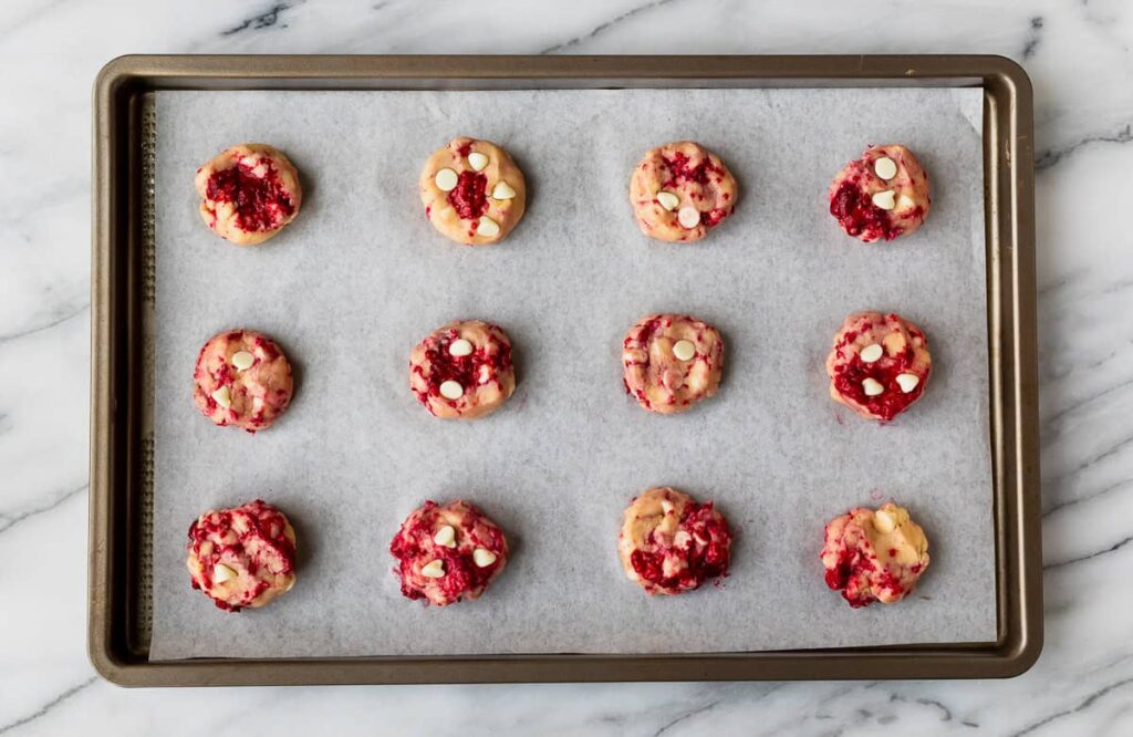 Roll the dough into 1-inch balls and place them about 2 inches apart on a baking sheet lined with parchment paper or a silicone baking mat
