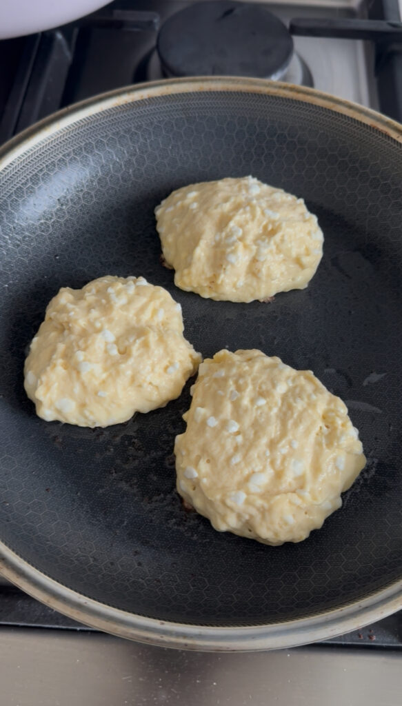 Scoop about ¼ cup of batter into the pan for each pancake, letting the batter mound slightly