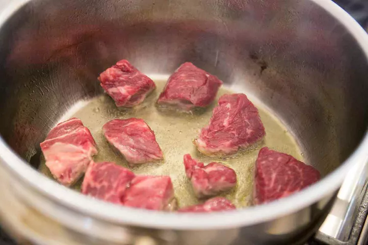 Season the beef pieces with salt and pat them dry