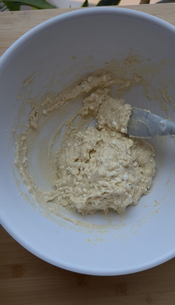 Sprinkle the sugar, baking powder, and salt over the mixture and stir until evenly combined
