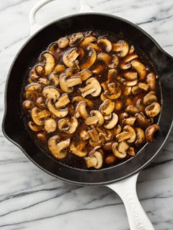 Stir in the garlic and Marsala wine, allowing it to simmer and reduce slightly