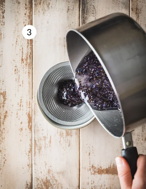 Strain the cooled syrup through a fine mesh strainer into a bowl, discarding the lavender buds. A few tiny specks may remain, which is perfectly fine