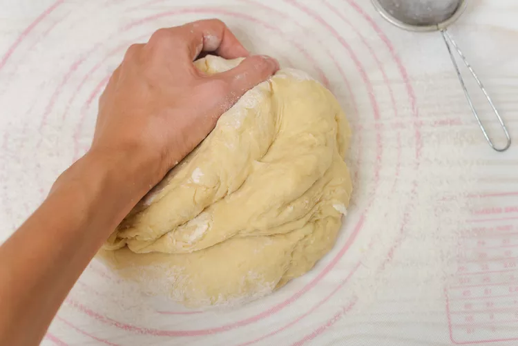 Transfer the dough to a floured surface and knead until smooth and elastic