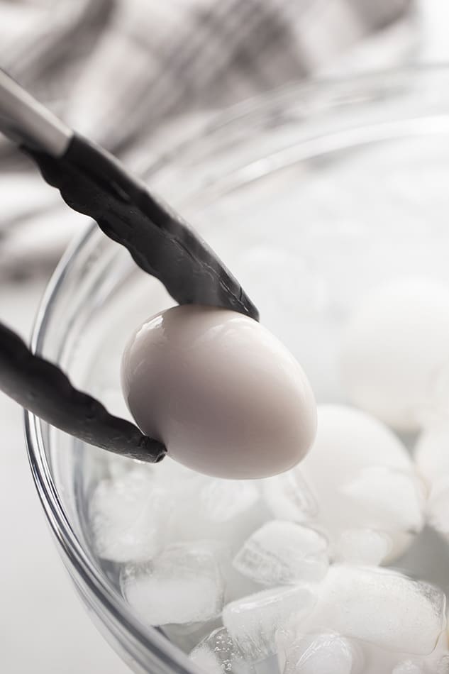 Transfer the eggs to an ice bath to cool completely, then peel under running water