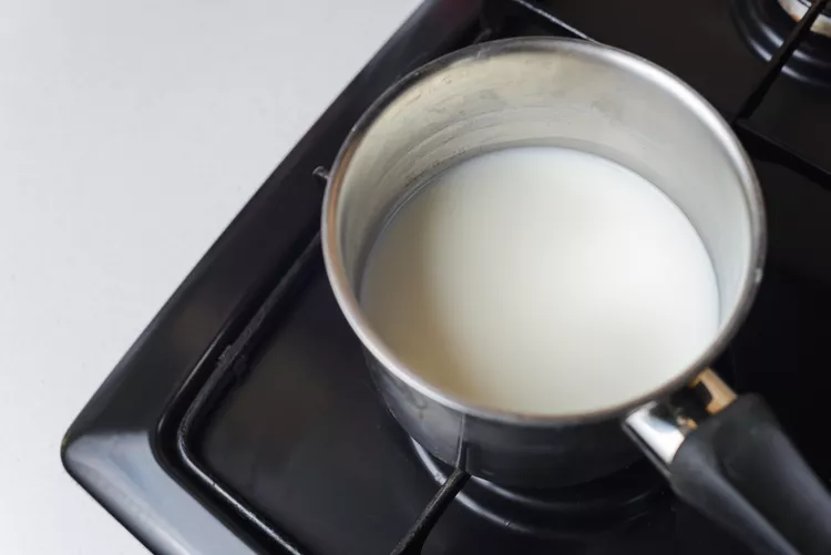 Warm the milk and water gently until just warm to the touch