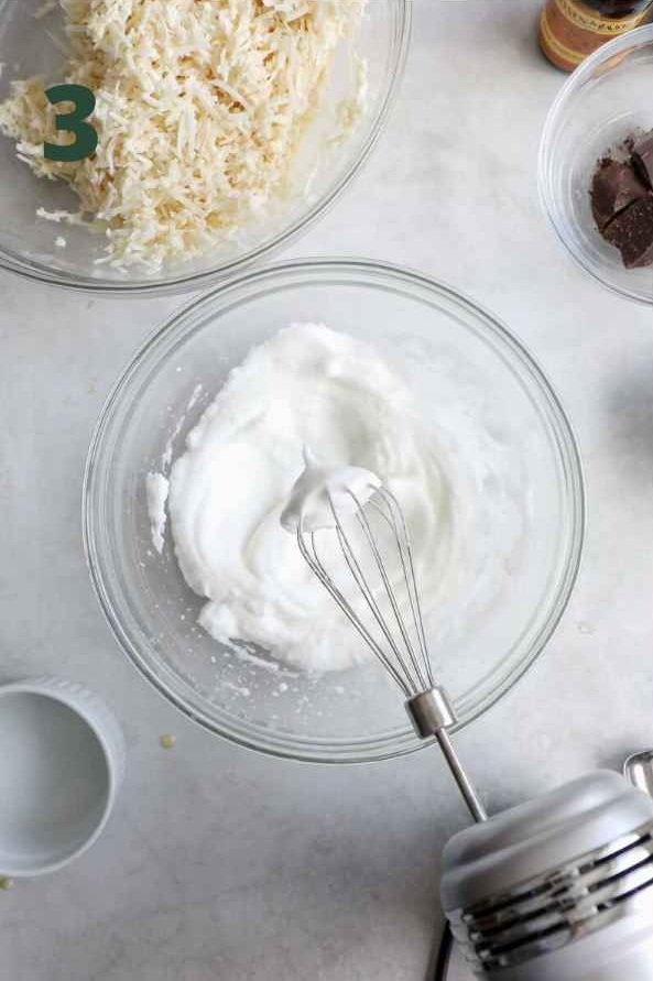 Whip the egg whites using a mixer until stiff peaks form