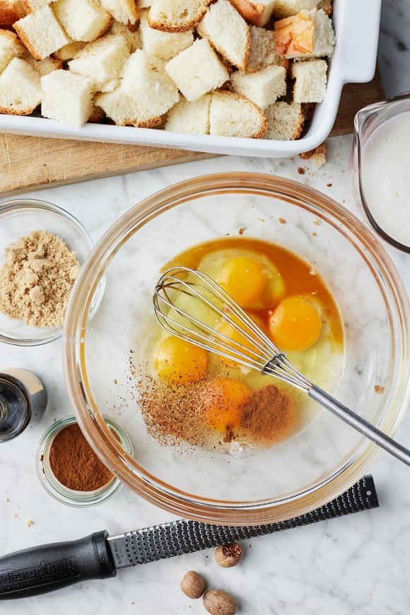 Whisk together eggs, milk, brown sugar, vanilla, cinnamon, nutmeg, and salt until smooth