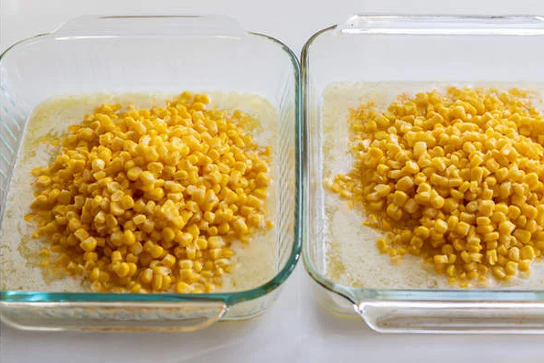 Add the drained whole kernel corn to the pan, followed by the creamed corn, making sure to include all of its liquid for moisture