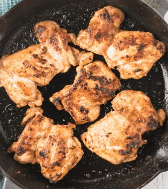 Cook the chicken until browned on one side, then turn and cook the other side until fully cooked through