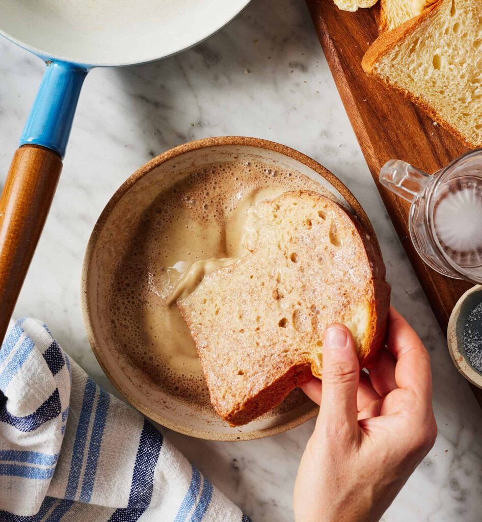Dip each slice of bread into the batter, turning to coat both sides evenly