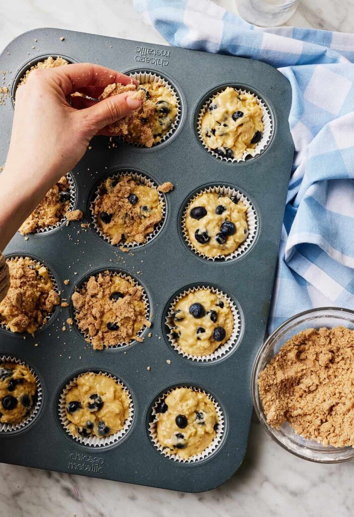 Divide the batter evenly among the muffin cups, then sprinkle the crumble topping over each portion