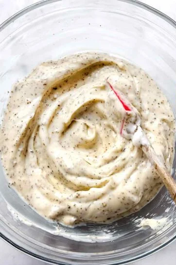 In a separate bowl, combine the Miracle Whip, mustard, celery seed, salt, and pepper. Mix until smooth and well blended