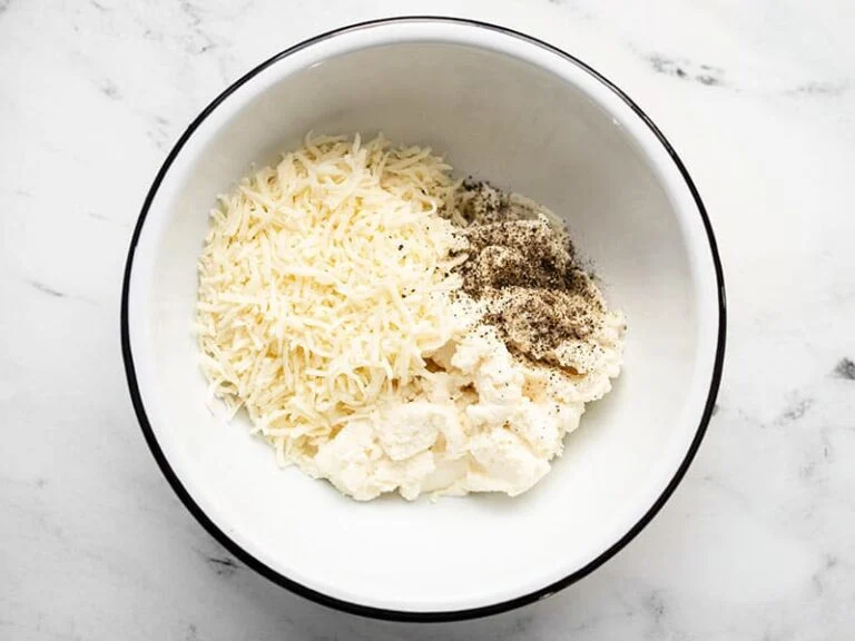 In a separate bowl, mix the ricotta, Italian cheese blend, and black pepper until smooth and well combined