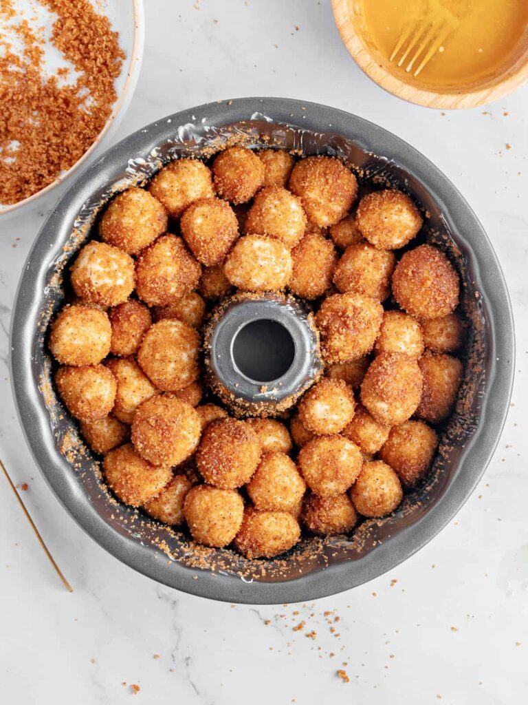 Preheat the oven and bake until the top is golden brown and the bread is fully cooked through.