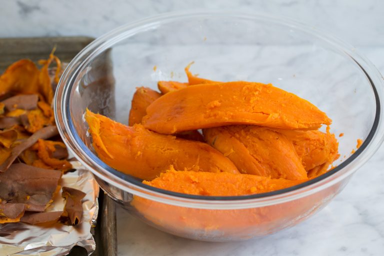 Peel the sweet potatoes and transfer them to a large mixing bowl