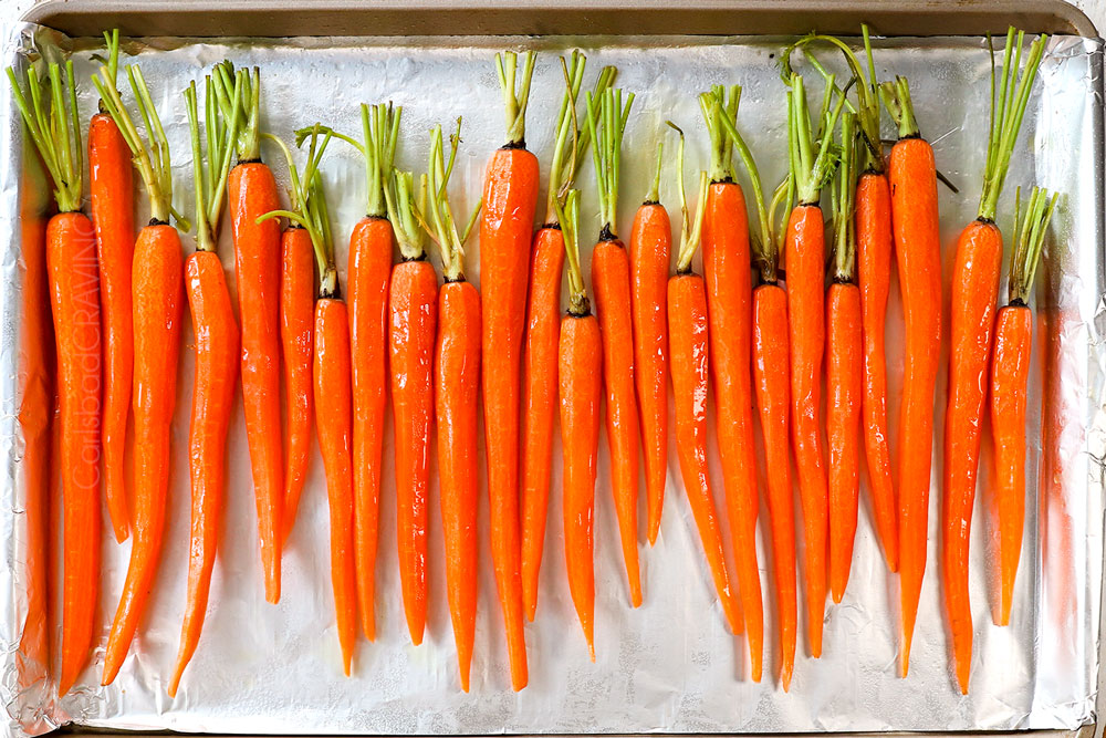 Place the carrots on the baking sheet and toss them with part of the olive oil until evenly coated