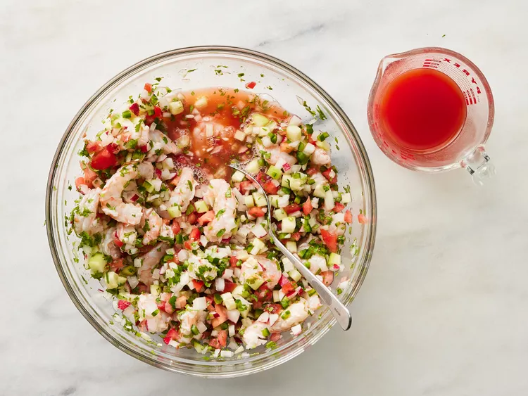 Pour in the tomato and clam juice cocktail until you reach your preferred consistency, whether slightly saucy or more brothy
