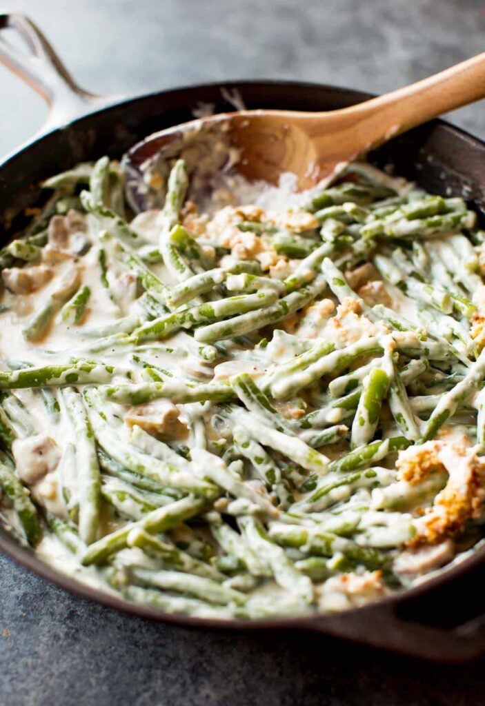 Remove the skillet from heat and stir in the green beans along with a portion of the baked onions