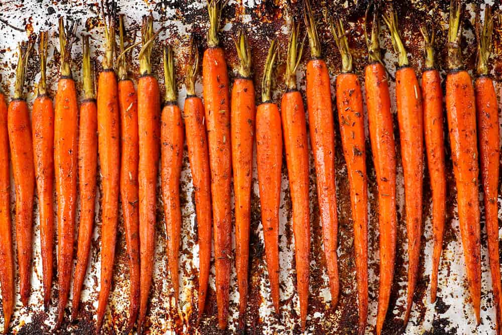 Return the carrots to the oven and continue roasting until they are fork-tender and caramelized on the edges