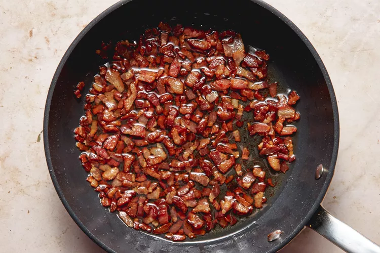 While the potatoes bake, cook the chopped bacon in a frying pan over medium heat until crispy. Remove and drain on paper towels.