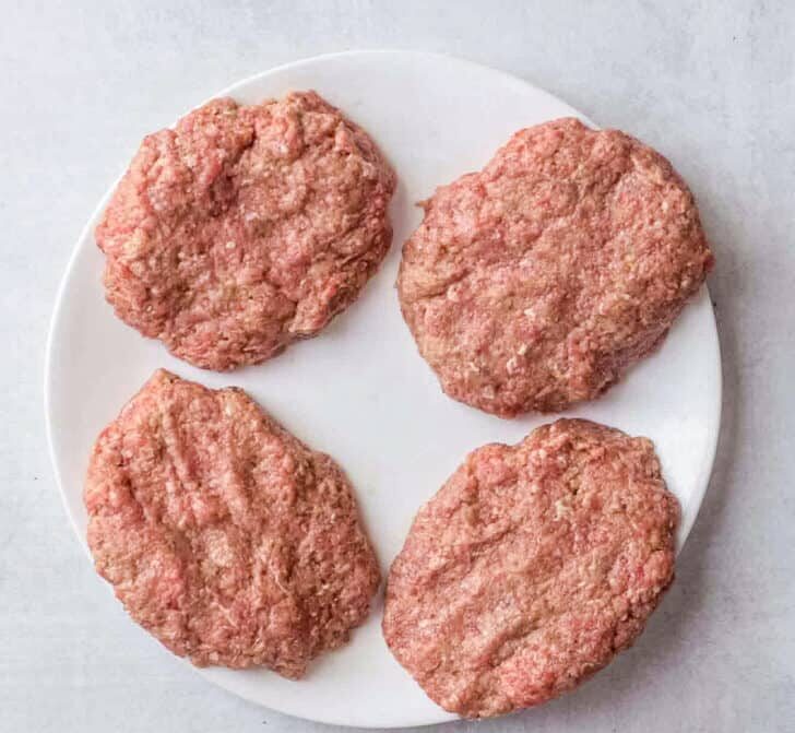In a large bowl, combine all ingredients for the beef patties except the oil. Mix gently until everything is just incorporated, then shape into evenly sized patties, slightly flattening the centers.