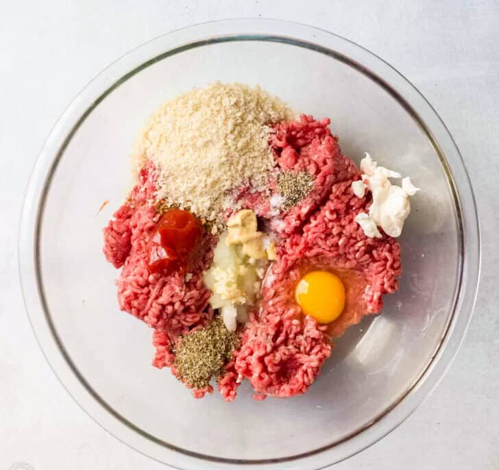 In a large bowl, combine all ingredients for the beef patties except the oil. Mix gently until everything is just incorporated, then shape into evenly sized patties, slightly flattening the centers.