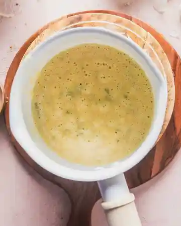 Sprinkle in the flour gradually while whisking continuously and cook briefly to remove the raw flour taste