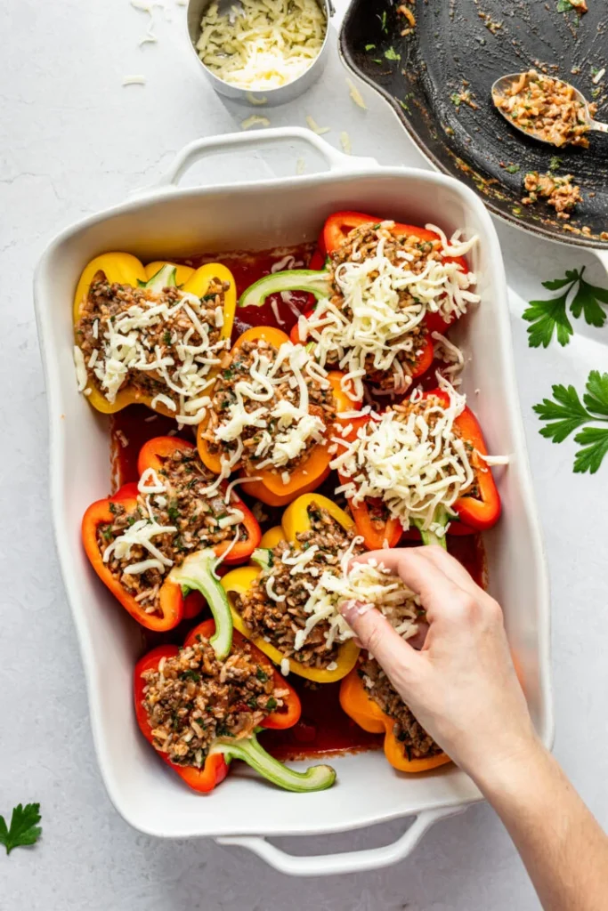 Sprinkle the remaining cheese over the top of each stuffed pepper for a melted finish