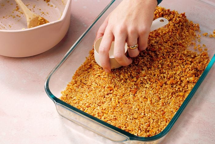 Preheat the oven to 350°F and prepare a 9x13-inch baking dish. In a bowl, combine crushed pretzels, melted butter, and sugar, mixing until evenly coated. Press the mixture firmly into the bottom of the dish to form a crust, then bake until set and lightly golden. Allow the crust to cool completely on a wire rack.